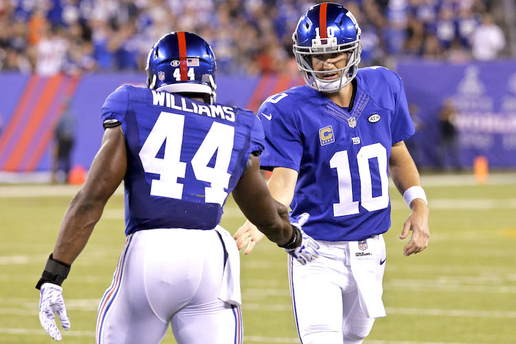 Andre Williams and Eli Manning