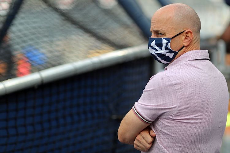 Brian Cashman would rather fill two open rotation spots with